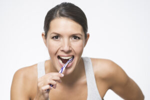 Woman brushing her teeth