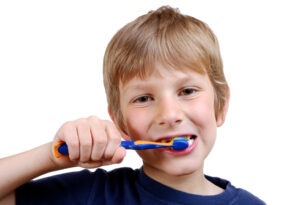 Young boy brushing his teeth